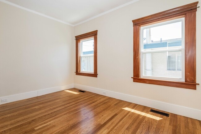 Second bedroom with natural light and storage. - 431 Athol Ave
