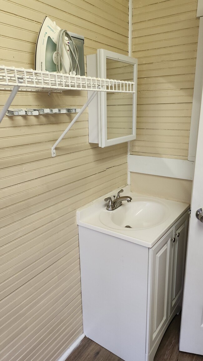 New vanity in half bath. - 208 NW 3rd St