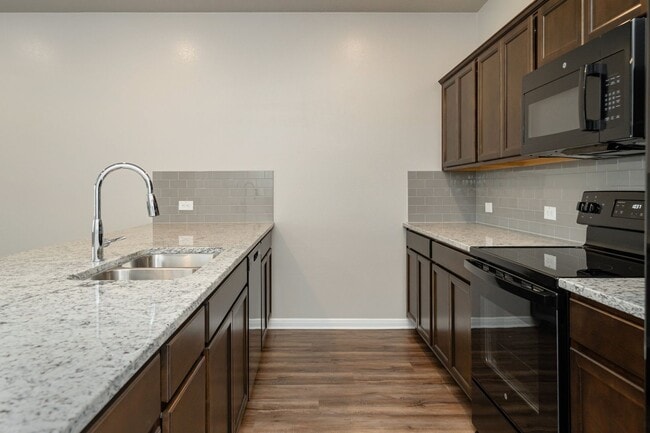 Building Photo - Live, love, and grow in this charming townhome!