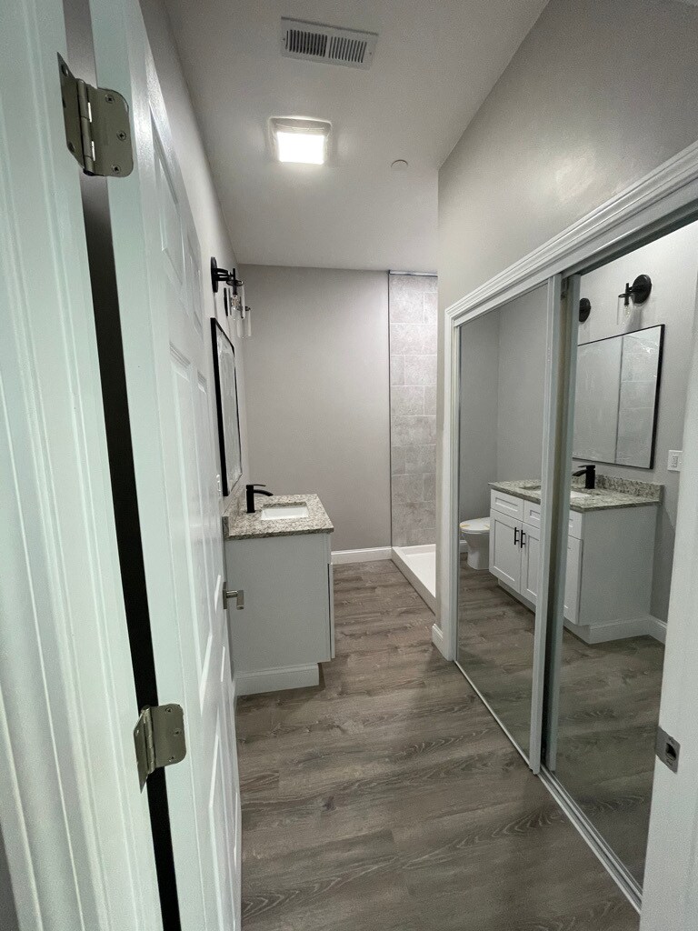 Unit two: bathroom (*brand new sliding glass shower doors have been installed) with laundry space an - 34 Falcon St