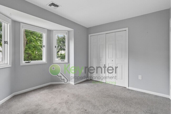 Building Photo - Spacious 2BR/2BA Duplex in Gated Community with Parking, Washer/Dryer & NYC Skyline Views