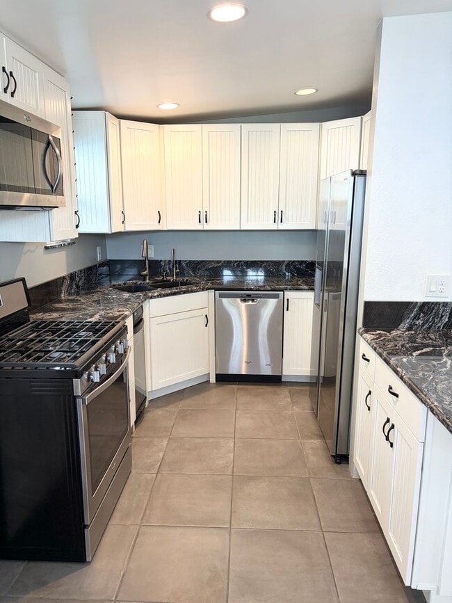 Building Photo - Beautifully Maintained 4-Bedroom Home with Private Backyard