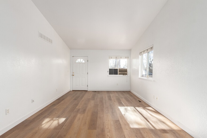 Living Room with vaulted ceilings - 3249 N Madison St