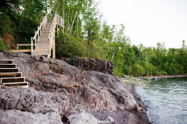 Stairs down to the private beach for lake access. - 6012 Highway 61