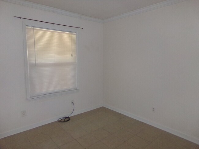Building Photo - 2BR/1BA Milton Duplex with Huge Fenced Backyard, Tile Flooring Throughout & Convenient Access to ...