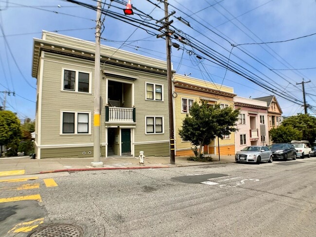 Building Photo - TOP FLOOR, Corner Studio. Hardwood Floors!...