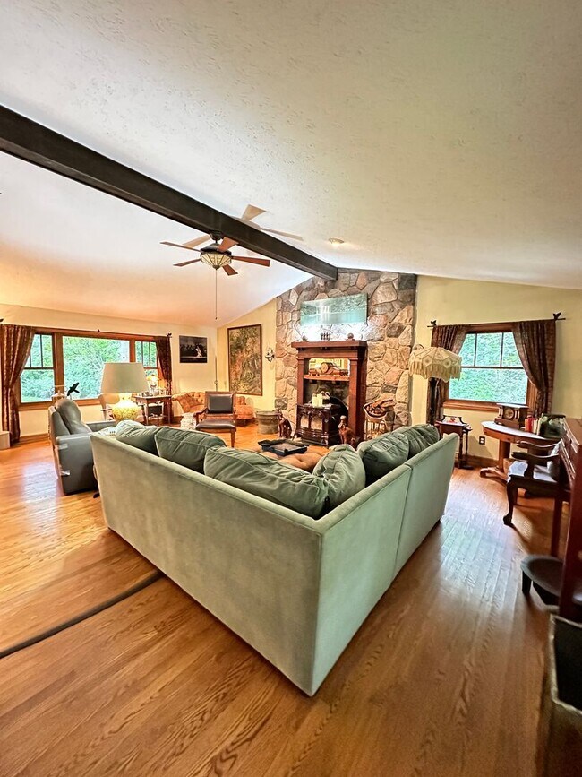 Building Photo - Dream Home in Highland, Michigan: Your Private Oasis on 5 Wooded Acres