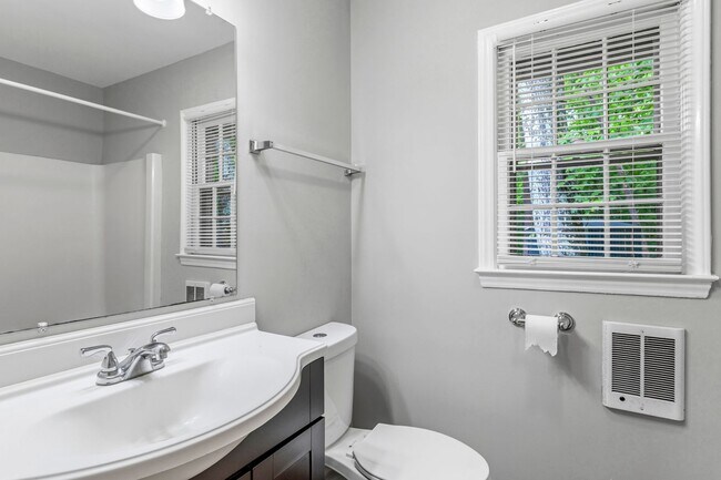 Building Photo - Updated Home, Stainless Steel Appliances, Wood Like Flooring, Deck, Garage!