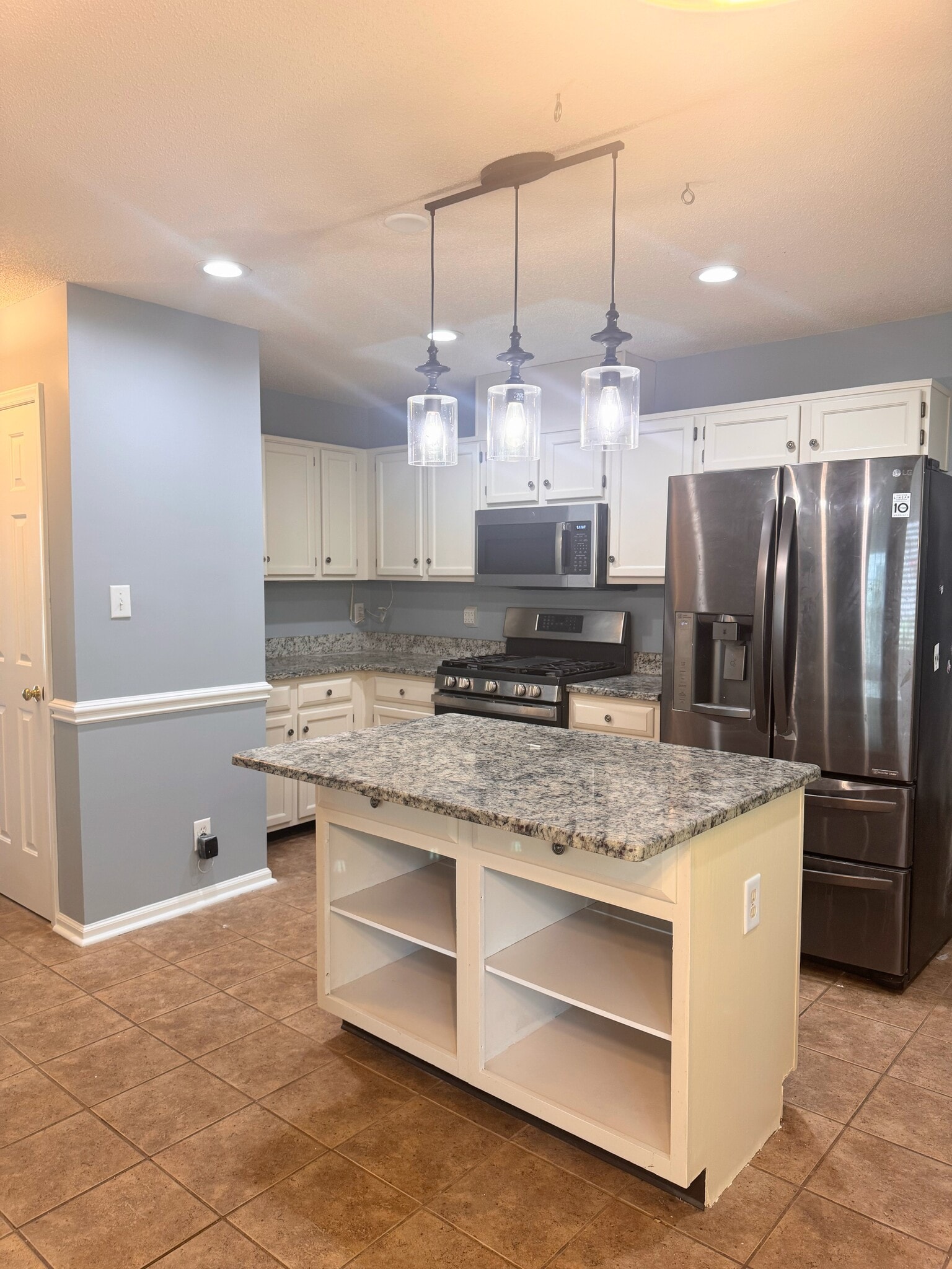 Kitchen with stainless steel appliances - 144 Swan Quarter Dr
