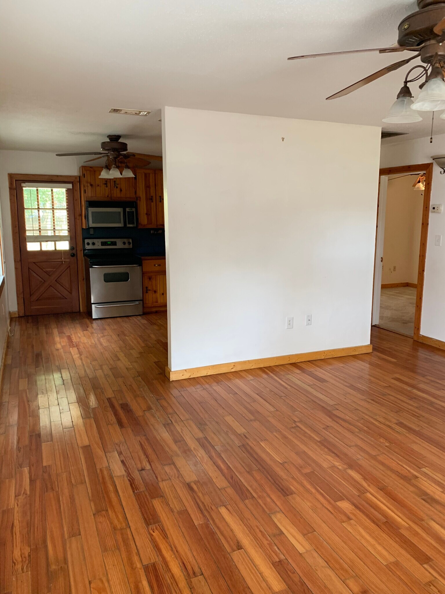 Access from living room to kitchen, backyard , right side is bedrooms. - 4911 23rd St W
