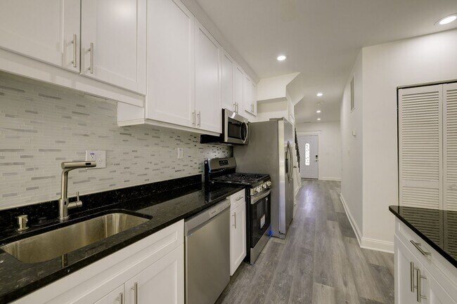 Building Photo - Charming & Renovated Petworth Rowhouse with Parking -  Available Now!