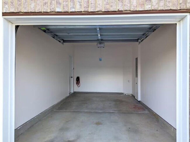 Single garage with NEMA 14-50 outlet. Additional parking for a single car in the driveway. - 11233 Winding Brook Terrace Dr