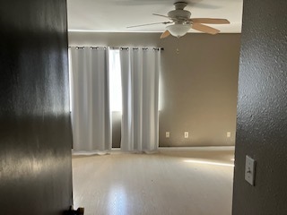 Large window and ceiling fan in bedroom - 8945 Field St