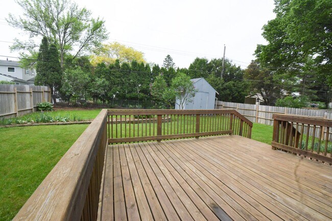 Building Photo - Beautiful multi-level with Gorgeous Yard and LOTS of Storage!