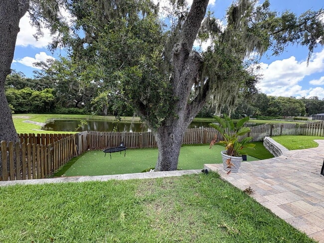 Building Photo - Spacious 5-Bedroom Pool Home with Putting ...