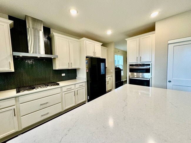 Building Photo - Newly Built 5-bedroom featuring luxe finishes and a spa-inspired master suite.