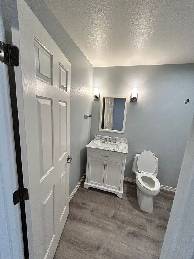 Building Photo - Spacious Duplex with 3-Car Garage & Private Patio!