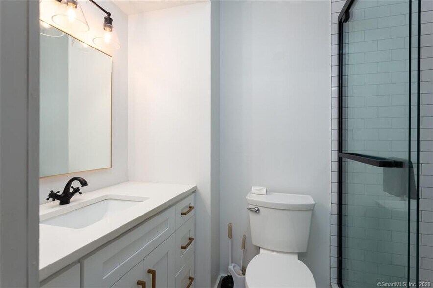 Bathroom with quartz counters and large shower - 188 Flax Hill Rd