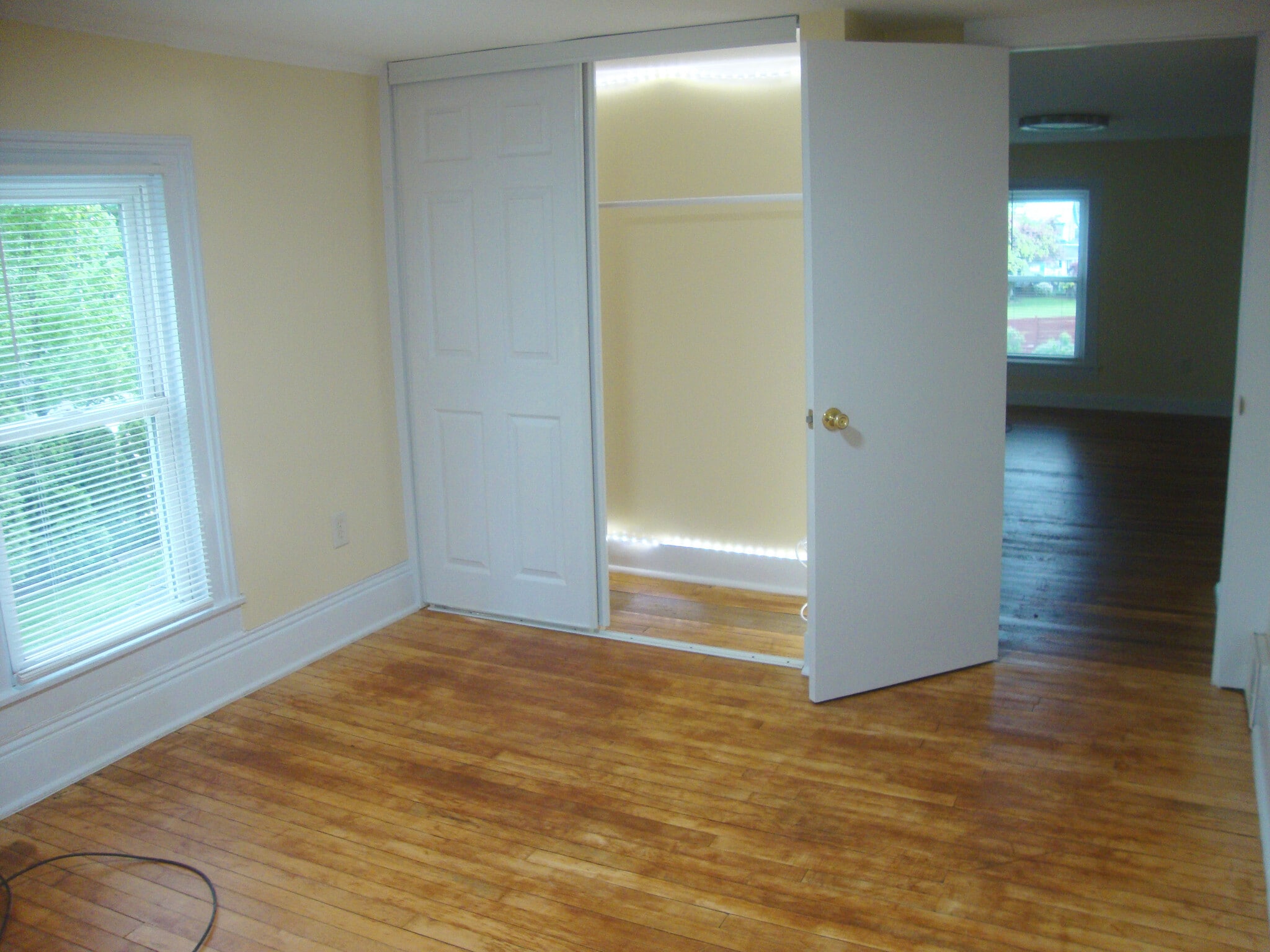 Second bedroom toward closet and doorway to living room. - 351 W Currant St