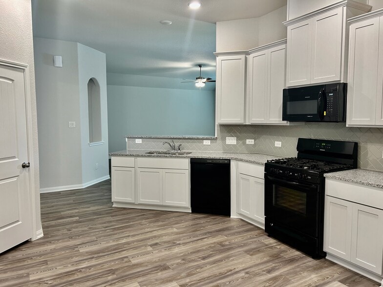 Your spacious kitchen features a gas range, granite counters and plenty of storage! - 509 Turtle Dove Dr