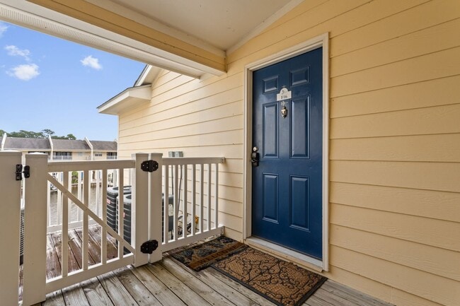 Building Photo - Welcome to Coastal Living at Harbor Landing Condominiums!