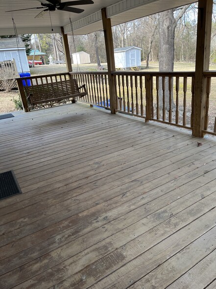 Covered back porch with swing - 1000 N Greensboro St