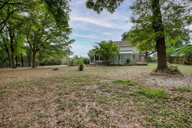 Building Photo - Spacious 3BR Retreat with Soaring Ceilings & Screened Porch