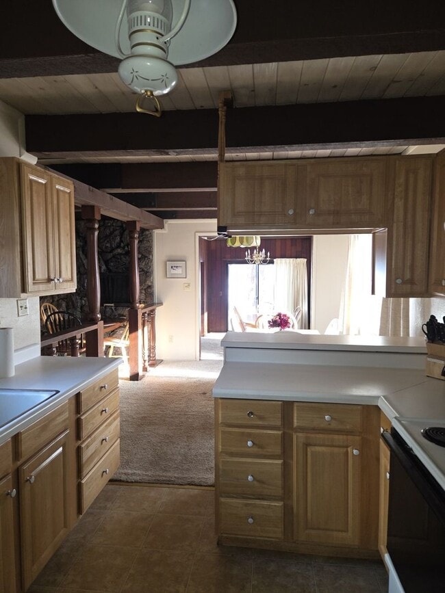 Building Photo - Unique open design,wood beams in all rooms-Very cheery and cozy. Newly remodeled, and newly furni...