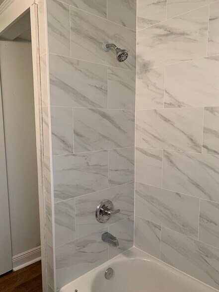 FULL BATH - tub/shower surround and storage behind - 1215 Foucher St