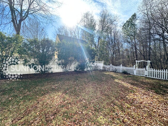 Building Photo - Wooded, Charming 3 Bedroom with Tons of Space