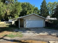 Building Photo - Charming Redding Home with Fireplace & Vau...