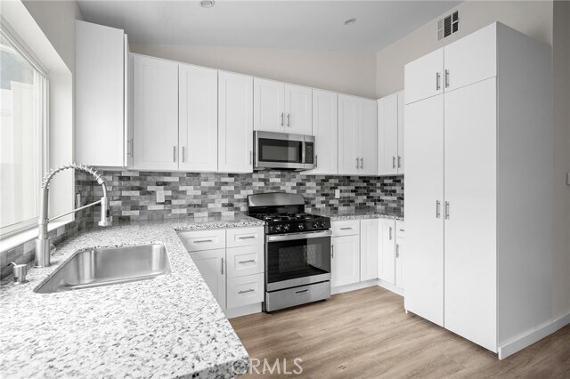 Building Photo - 10321 Sherman Grove Ave