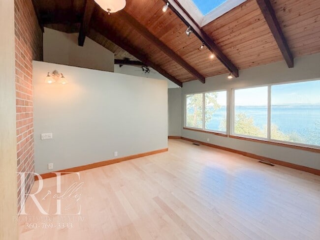 Building Photo - Waterfront Rustic Retreat with Vaulted Ceilings, Picture Windows & Lofted Nook