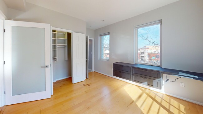 Building Photo - Newly Renovated Two Bedroom W/Floor to Cei...