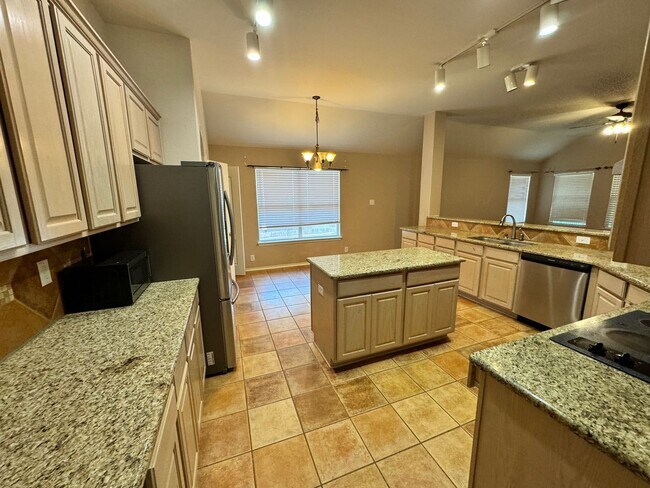 Building Photo - Ready For Move In! A Must See in Rogers Ranch - 4 Bedroom 2 Bath with Custom Features