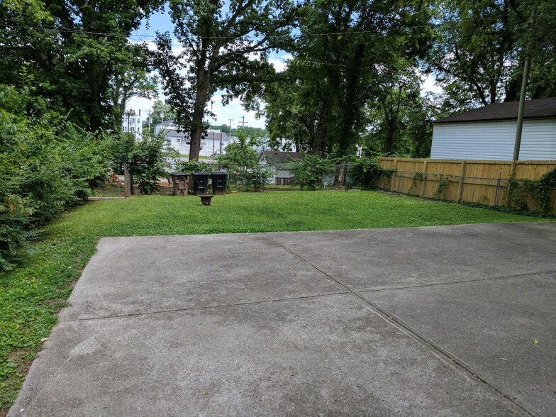 Parking area in back with backyard - 2418 Brasher Ave