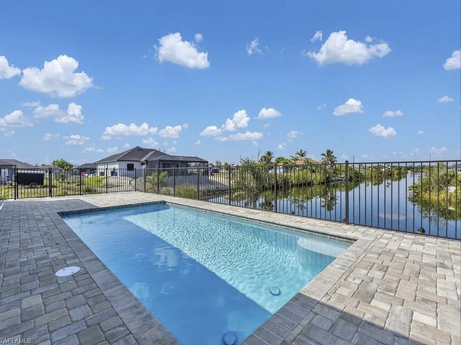 Building Photo - Almost New Construction Waterfront Home in NE Cape Featuring A Pool, Fenced Yard & More! COMING SOON