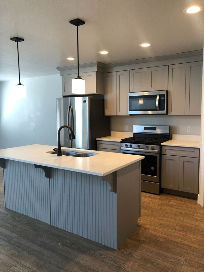 Building Photo - AMAZING HOME IN SOUGHT AFTER EXCHANGE DEVELOPMENT W/ 2 CAR GARAGE