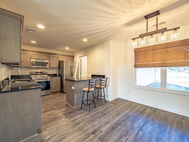 Building Photo - Available now! Has solar panels!