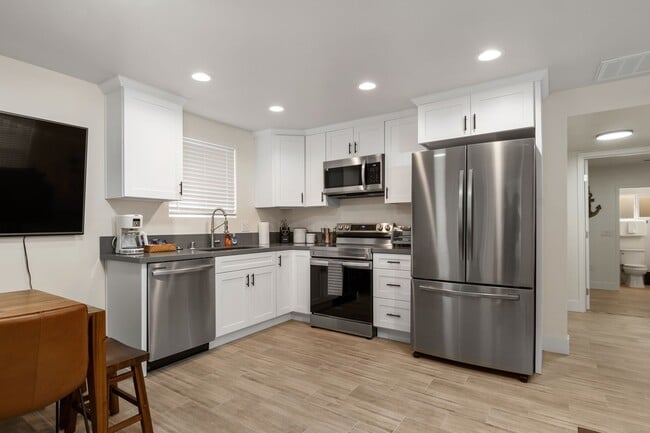 Building Photo - Beachside 3BR Home | Remodeled | AC | Garage Parking | Walk to Boardwalk