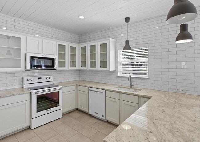 Building Photo - Discover the perfect blend of comfort and space at 6323 Myrtle.