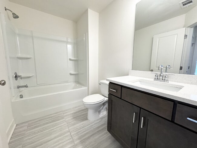 Building Photo - Stylish 3BR Townhome with Private Yard & T...