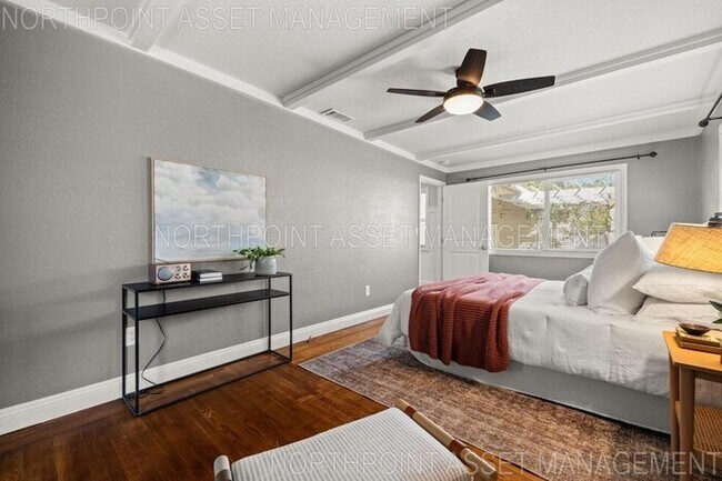 Building Photo - Welcome to this stunning 4-bedroom, 2-bath...