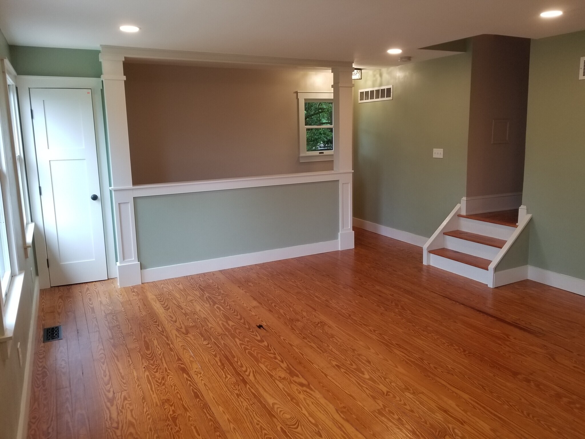 Green family room repainted a neutral beige - 222 Bohemia Ave