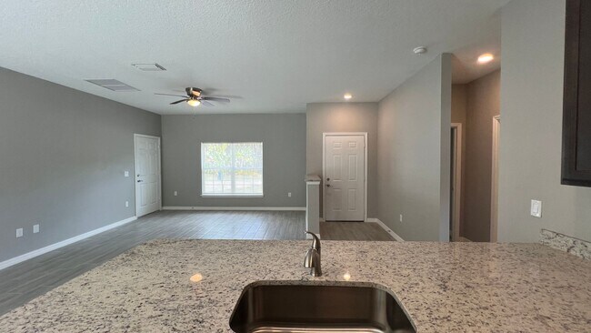 Building Photo - Smart & Stylish 3BD/2BA Palm Bay Home – Modern Upgrades, No Water Bills!