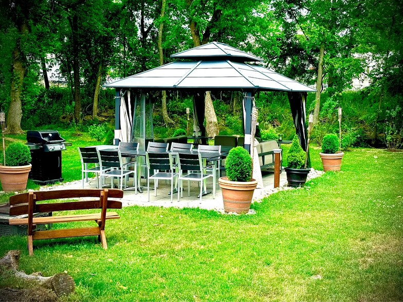 Shared backyard with gazebo, fire pit, and grill - 261 Main St