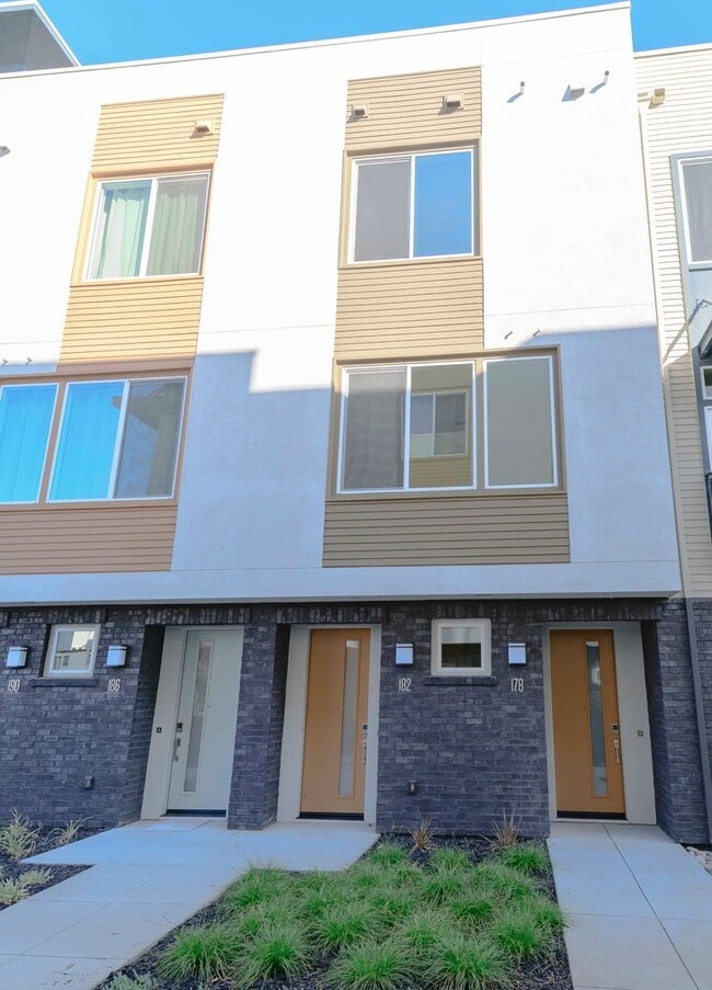 Building Photo - Experience contemporary urban living at its finest. Private Garage & Dual Suites!