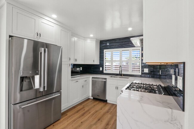 Building Photo - Renovated Lake Forest Home with Expansive Yard & Modern Finishes