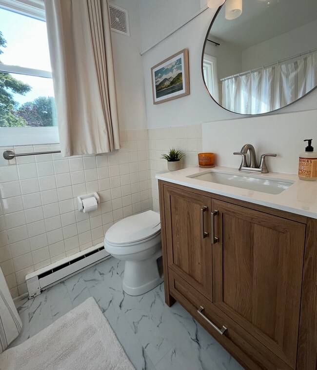 Bathroom (new flooring, lighting & mirror) - 91 Faith St