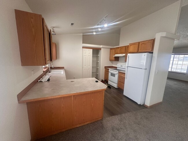 Building Photo - Newer Carpet, flooring & paint! 3 Bedroom 2 Bath with 2 car attached garage.